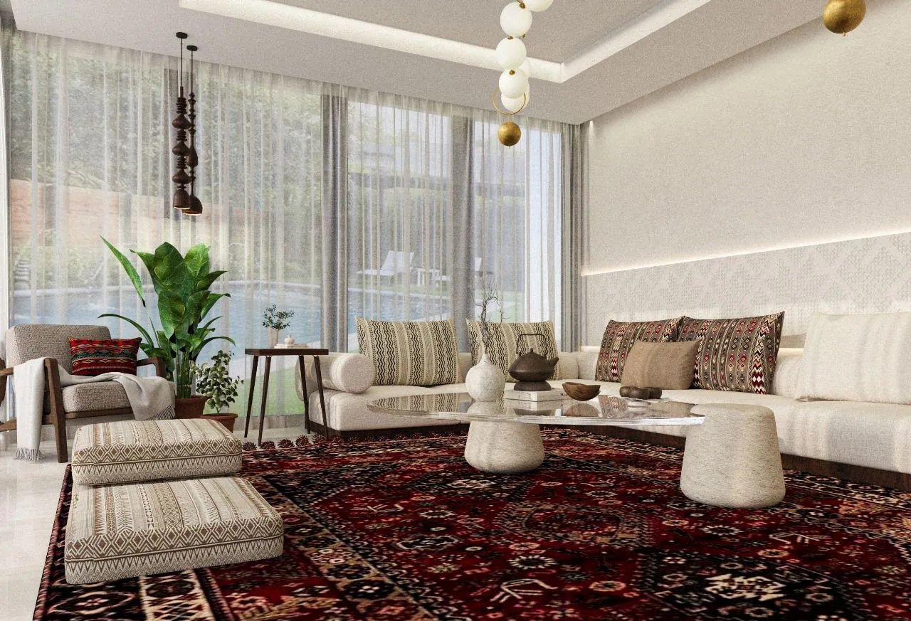A living-room angle with corner seating, white tables and a suspended globe light